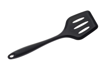 Kitchen tool in the form of a spatula made of black plastic for cooking