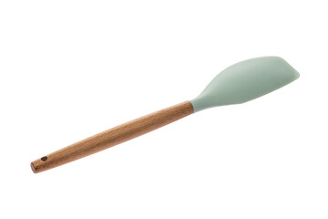 Kitchen tool in the form of a spatula made of green plastic with a wooden handle for cooking