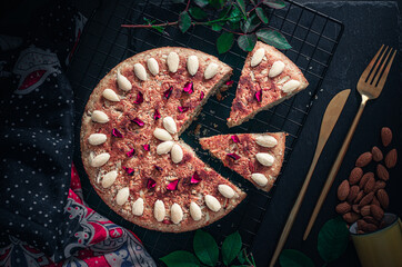 Homemade almond and lemon cake with sliced almonds topping