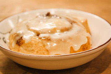 Delicious hot cinnamon roll with icing