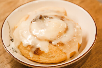 Delicious hot cinnamon roll with icing