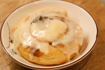Delicious hot cinnamon roll with icing