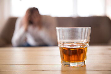 glass of whiskey. Sofa. Home concept. Problem. Alcohol. 