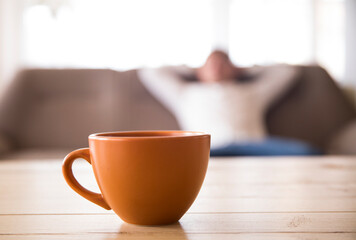Good morning. Coffee cup. Sofa. man posing sofa. Home. 