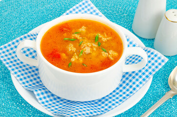Thick homemade vegetable soup with rice, pumpkin and tomatoes