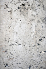 Vertical shot of a rough concrete wall as a background