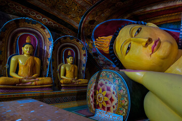 Mulkirigala, Sri Lanka, Asia, 02.07.2014: statues of Buddha lying and sitting inside the caves of the Mulkirigala temple