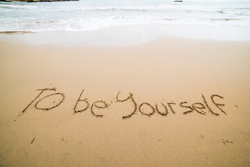 Words written on the sand on the beach