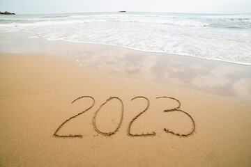 Words written on the sand on the beach