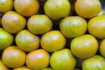 Closeup shot of fresh oranges in a market place