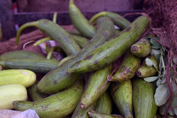 Closeup shot of a pile sponge gourd of in a market place