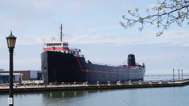 Large Black Boat Docked on the Great Lake