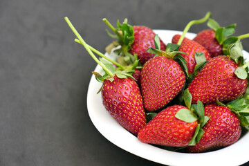a plate of fresh ripe strawberries, close-up strawberries,