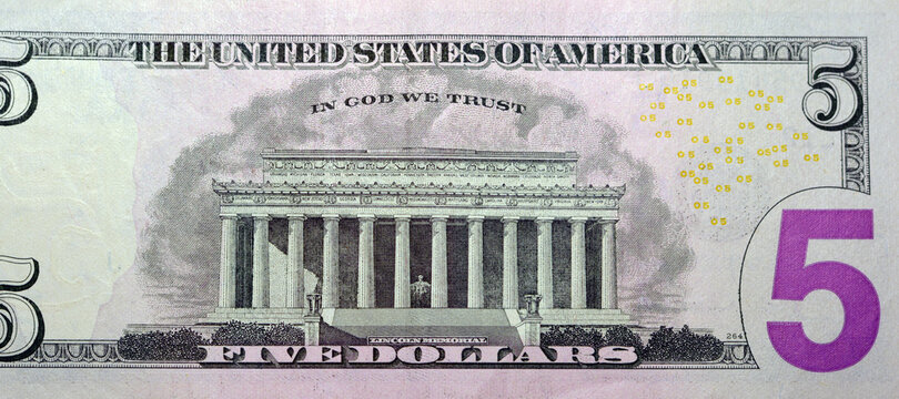 treverse side of 5 dollars portrait, five American dollars banknote background, selective focus, united states dollars banknote