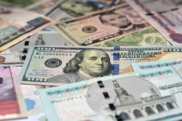 American dollars and Egyptian money background, United States of America currency with Egyptian...