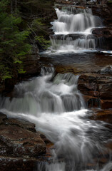 Fototapeta na wymiar Gorgeous waterfalls with multiple cascades in crawford notch new hampshire