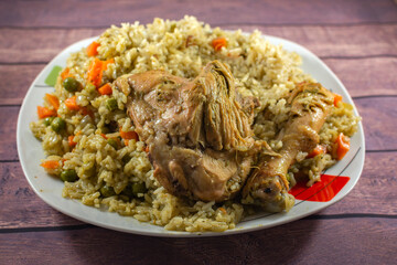 GREEN RICE WITH CHICKEN, WITH CHUNKED CARROT, GREEN PEAN AND PEPPER.