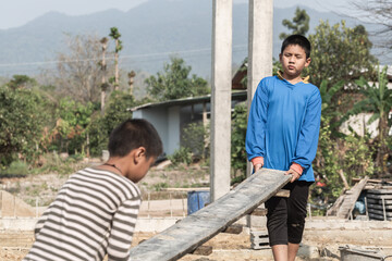 Concept of poverty and child labor, Children who are working on construction sites ,  Against child...