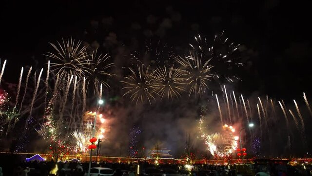 At the night of Lantern Festival, colorful fireworks light up the sky over the city, very beautiful.