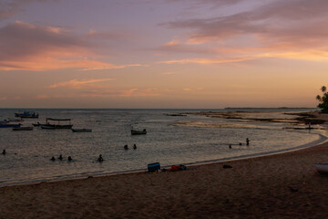 horizon of the sea from Praia do Forte - Bahia with boats in late afternoon