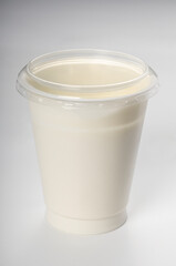 yogurt in plastic jar with lid isolated on white background