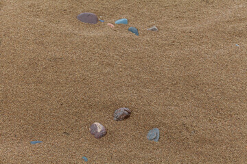 sandy surface with a few small pebbles