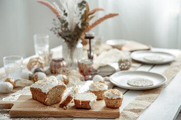 Close up of homemade Easter baked goods on festive table.