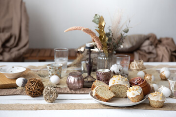 A beautifully set table for Easter with decorative details and pastries.