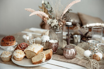 Fototapeta na wymiar A beautifully set table for Easter with decorative details and pastries.