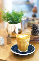 latte art coffee on wooden table