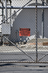 A warning sign on refinery gate