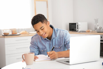 African-American student studying online at home