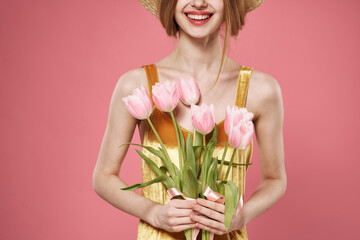 Woman with bouquet of flowers womens day 8 march pink background