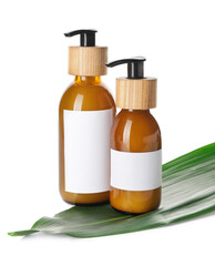 Bottles with natural shampoo on white background