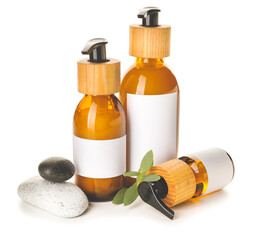 Bottles with natural shampoo on white background