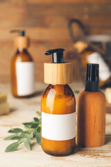 Bottles with natural shampoo on wooden background