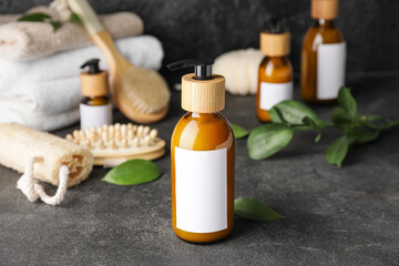 Bottles with natural shampoo on dark background