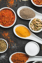 Different spices on dark background