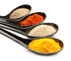 Spoons with different spices on white background, closeup