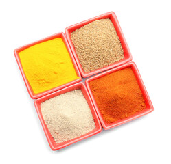 Bowls with different spices on white background