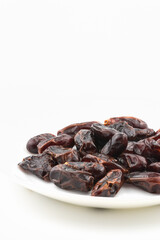 Date palm fruits on white background.
