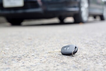 The missing car keys are placed on the road.