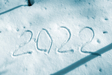 numbers 2022 in the snow. new year concept. blue tinted