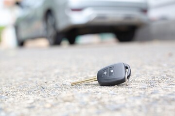 The missing car keys are placed on the road.