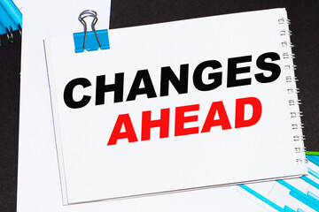 Naklejka premium Business concept. List with text sheet CHANGES AHEAD of paper for notes