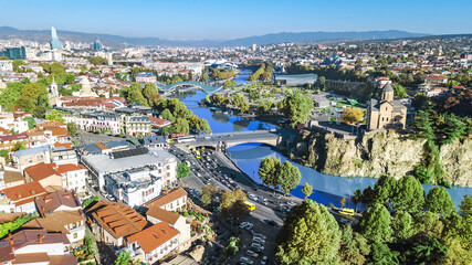 Fototapeta na wymiar Tbilisi skyline aerial drone view from above, Kura river and old town of Tbilisi cityscape, Georgia 