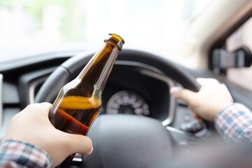 This woman eats beer while driving, emphasizes bottled beer.