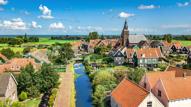 Aerial drone view of Marken island, traditional fisherman village from above, typical Dutch landscape, North Holland, Netherlands
