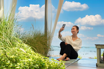 Happy traveler and tourism young women travel summer on the beach. relax outdoor destination leisure trip travel