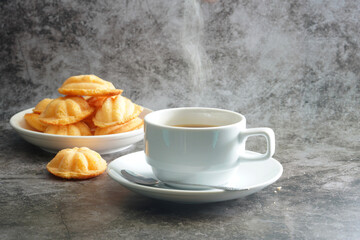 Hot cappuccino coffee cup and Thai Egg Cake , sweet thai (Blurre